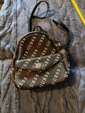 GUESS Women's Rainbow Logo Print Small Backpack Bag Handbag Purse - Black